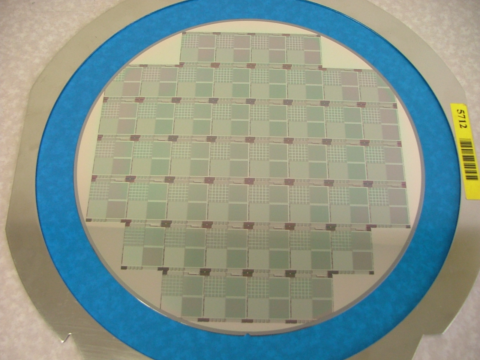 silicon wafer with various SiPM designs and integrated circuitry